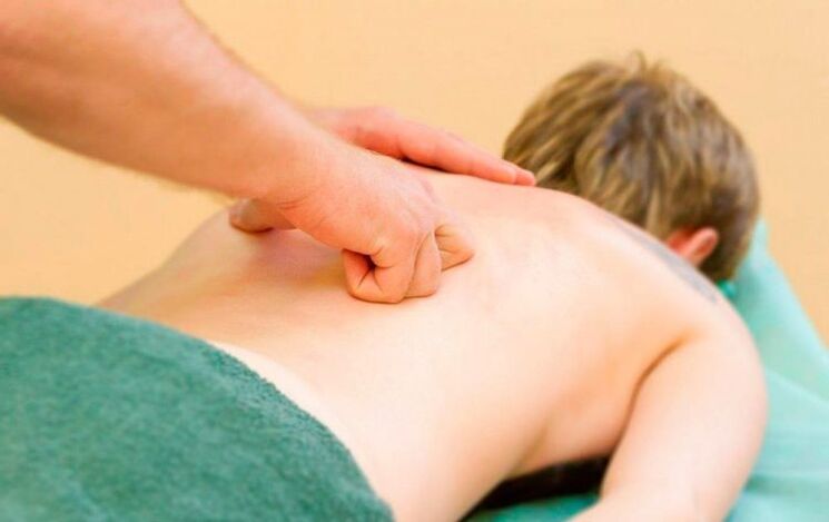 Performing chest back massage for osteochondrosis.